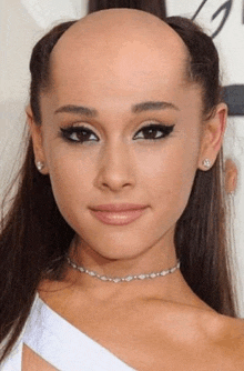 ariana grande has a bald head and a choker necklace .