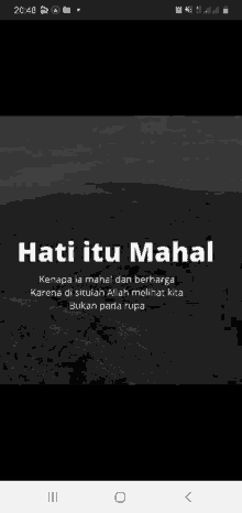 a black and white photo of a mountain with the words hati itu mahal on it .