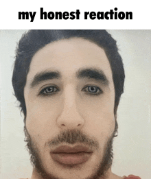 a close up of a man 's face with the words " my honest reaction " above it