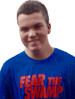 a young man is wearing a blue shirt that says fear the swamp