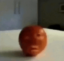 a ball with a face on it is on a table