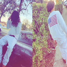 a man in a white shirt with an american flag on the back is sitting on the back of a car