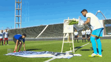 a man in a blue shirt is kneeling on a soccer field in front of a sign that says ' pepsi '