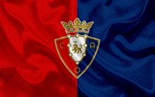 a red and blue flag with a lion and a crown