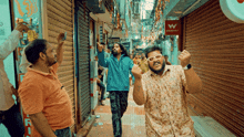 two men are dancing in a narrow alleyway in front of a store that says walmart