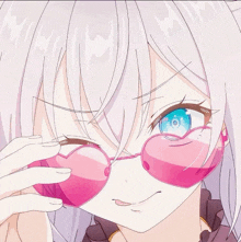 a girl with white hair and blue eyes wears pink heart shaped sunglasses