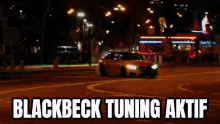 a car is driving down a street at night with the words blackbeck tuning aktif in the corner