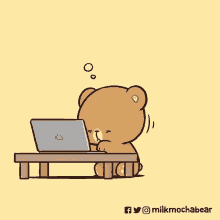 a teddy bear is sitting at a table using a laptop computer