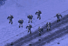 a group of robots are walking down a road in the snow