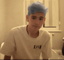 a boy with blue hair is wearing a white shirt with the letter j on the front