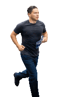 a man in a black shirt and jeans is running