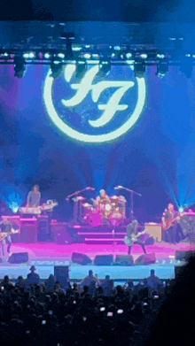 a band on stage with a large k7 logo