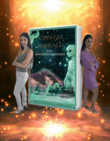 two women standing next to a book that says crystal emerald