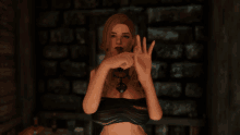 a woman in a black top is making a gesture with her hands in front of a brick wall