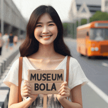 a woman holds up a sign that says museum bola