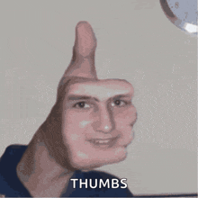 a man giving a thumbs up sign with his hand