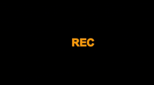 a black background with the word rec in yellow .