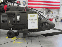 a military helicopter with a sign that says " the 5000 hawk "