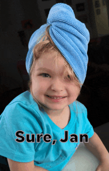 a little girl with a towel wrapped around her head and the name sure jan written on the bottom