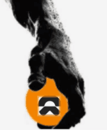 a black hand is reaching out towards an orange circle with the letter k on it