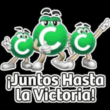 three green m & m 's are standing next to each other with the words `` juntos hasta la victoria '' below them .