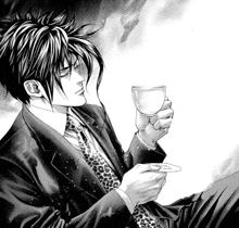 a man in a suit and tie is holding a glass of wine