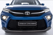 the front of a blue toyota urban cruiser car