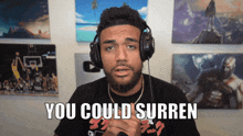 a man wearing headphones says " you could surren " in a video