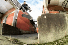 a man is doing a trick on a skateboard on a ramp