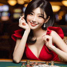 a woman in a red dress is sitting at a poker table with stacks of coins