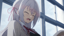 a girl with white hair and a red bow in her hair is smiling