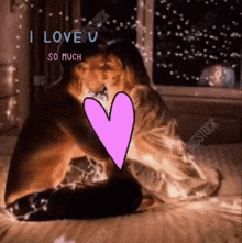 a man and a woman kissing on a bed with a pink heart and the words " i love you so much "