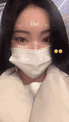 a woman wearing a face mask with dior written on it