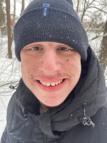 a young man wearing a beanie with the word blitz on it