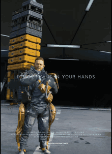 a poster for a video game called death stranding shows a man carrying crates on his back