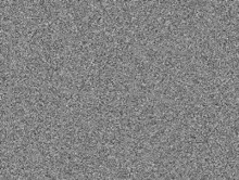 a close up of a gray background with a lot of small dots .