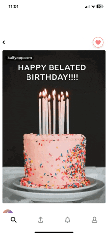 a phone screen shows a birthday cake with candles and sprinkles