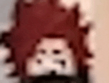 a blurry picture of a person 's face with red hair