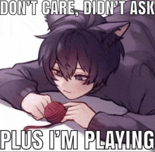 a cat boy is playing with a ball of yarn and a meme .