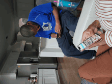 a man wearing a blue shirt that says thunder on it