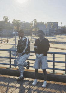 two men standing next to each other on a bridge with a city in the background