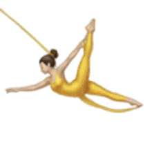 a woman in a yellow jumpsuit is doing aerial acrobatics .