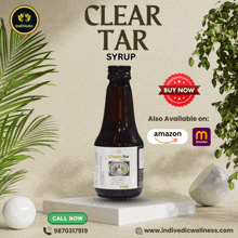 a bottle of clear tar syrup sits on a table