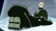 a cartoon character is laying on his back on a white surface .