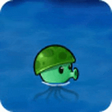 a green jellyfish with a helmet on is swimming in the water .