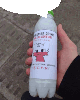 a person holding a bottle of mykisser drink