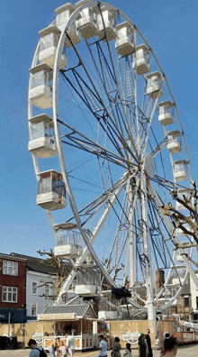 a ferris wheel with a kiosk in front of it