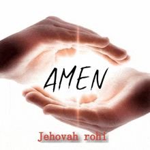 two hands are holding a light and the word amen is written on it .