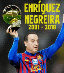 enriquez negreira is holding up a soccer ball