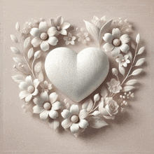 a white heart is surrounded by white flowers